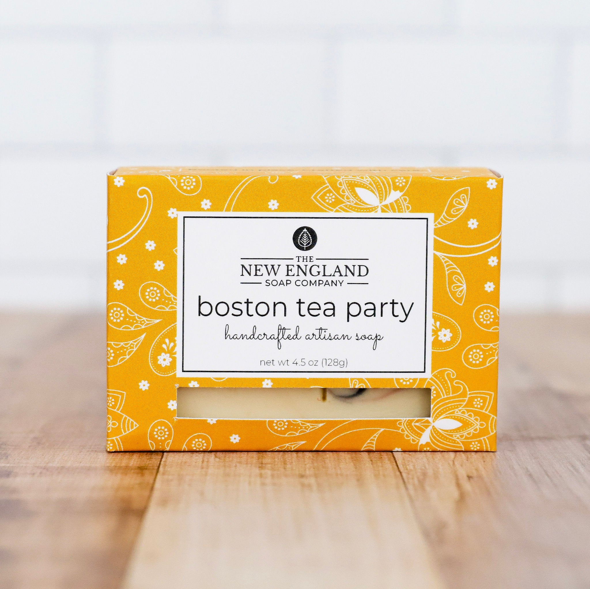 Box of New England Soap Company Boston Tea Party soap on a wooden surface with a white background