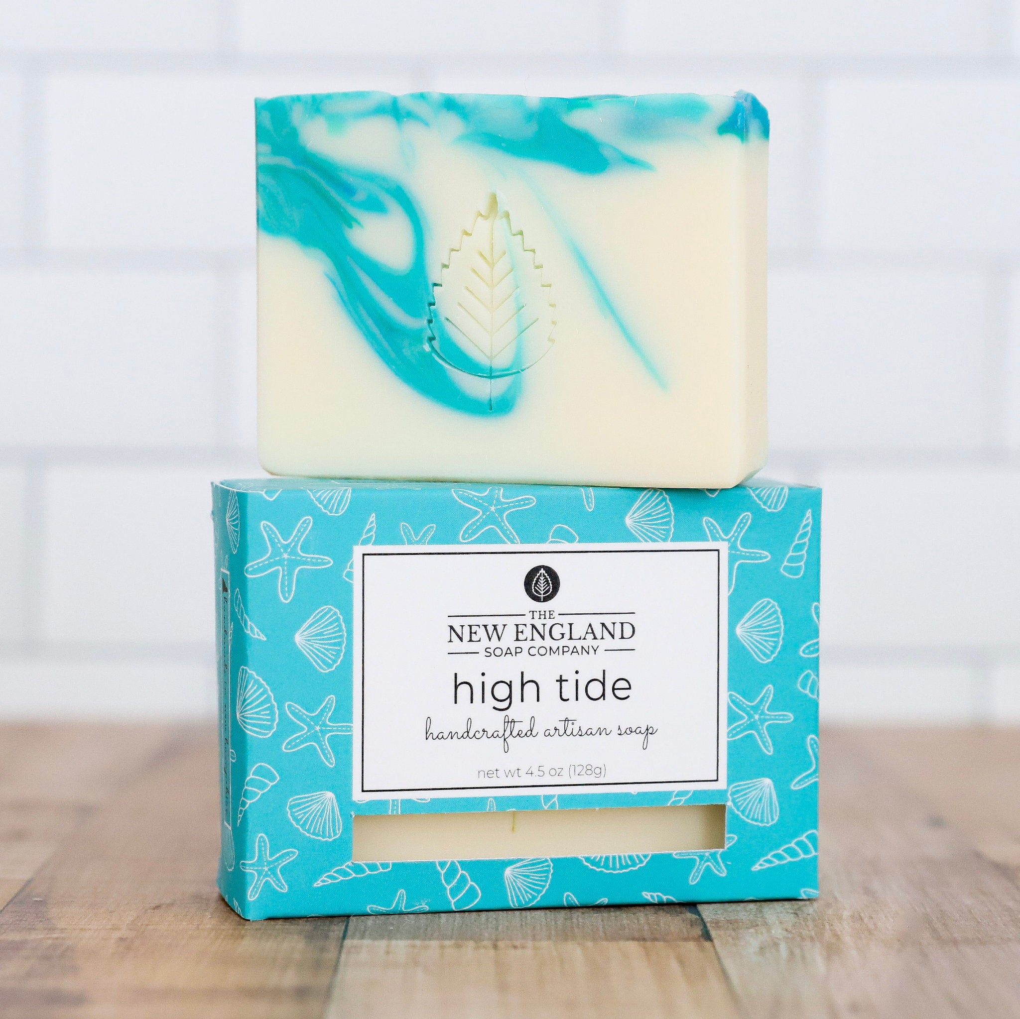 Bar of soap with a decorative box on a wooden surface