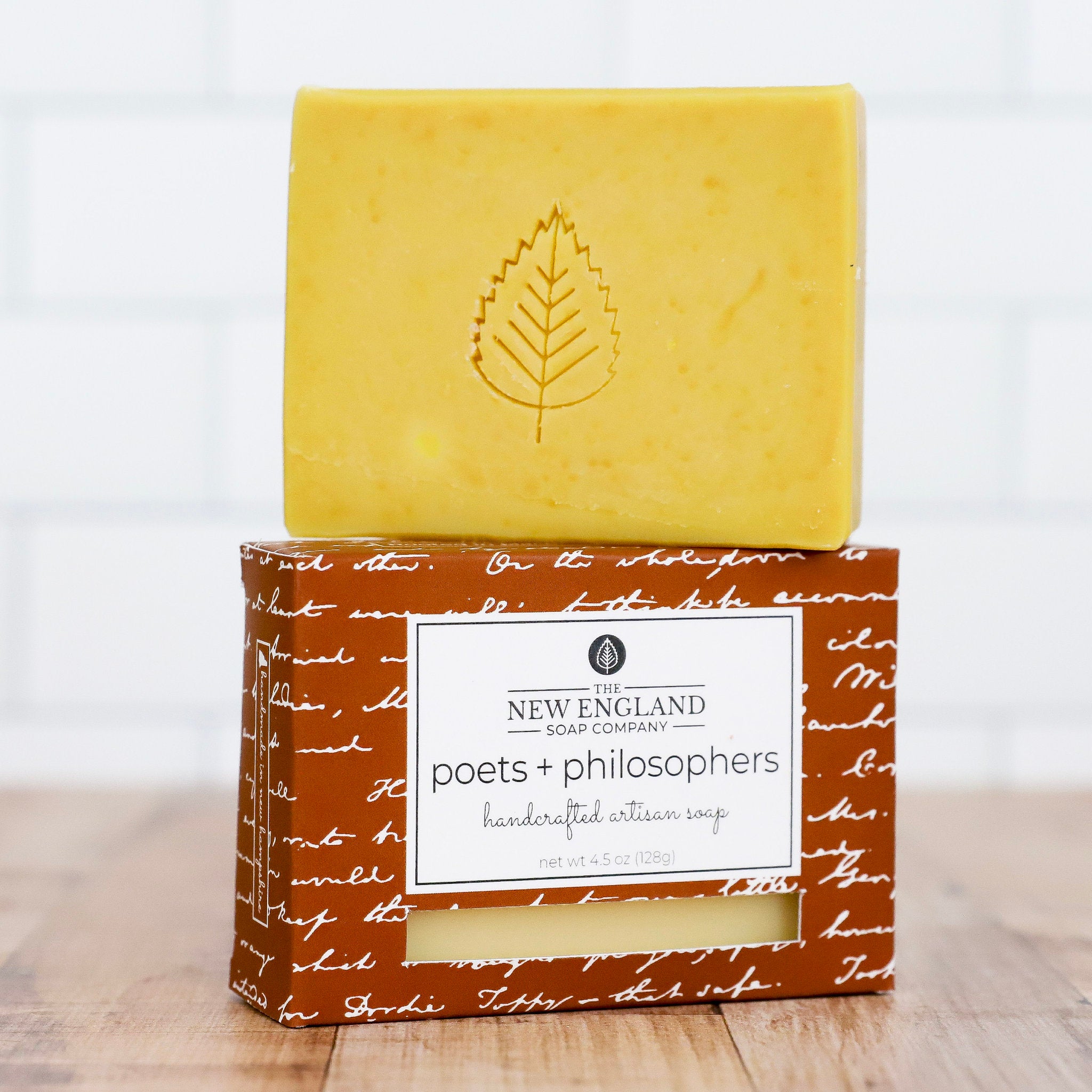 Yellow bar of soap on a brown packaging with &