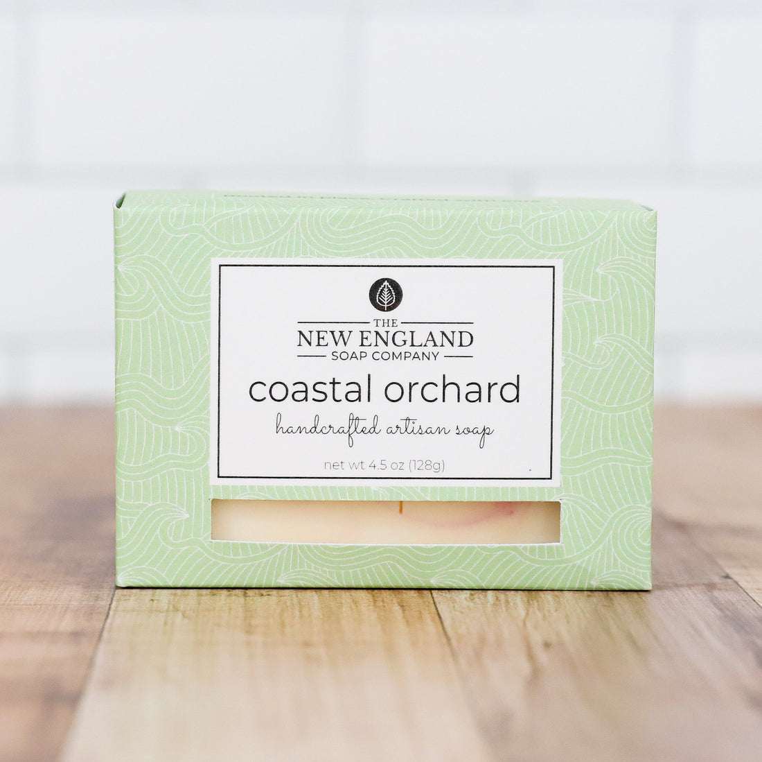 Box of New England Soap Company coastal orchard soap on a wooden surface